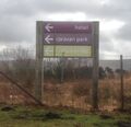 Sign saying 'hotel, caravan park, services (N)'.